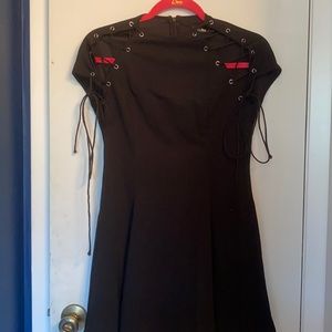 A black shoulder tie dress
